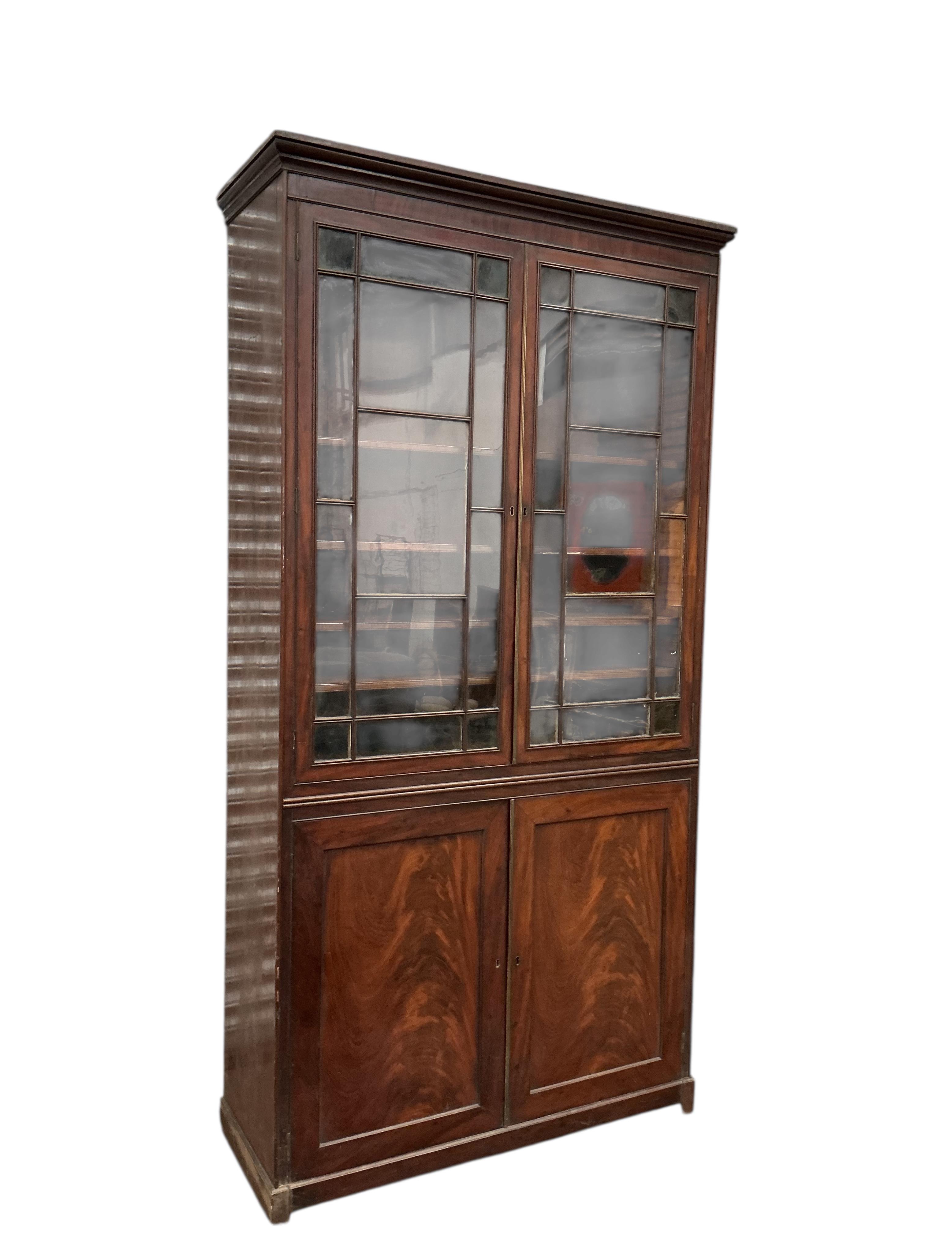 A George III mahogany bookcase, width 112cm, depth 42cm, height 225cm